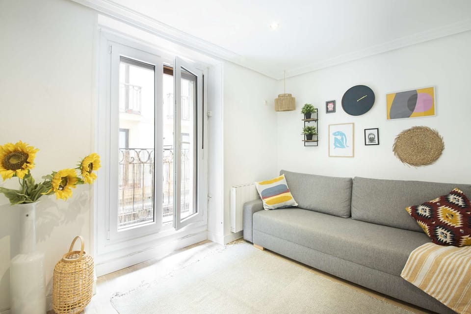 Lounge with double sofa, TV and balcony