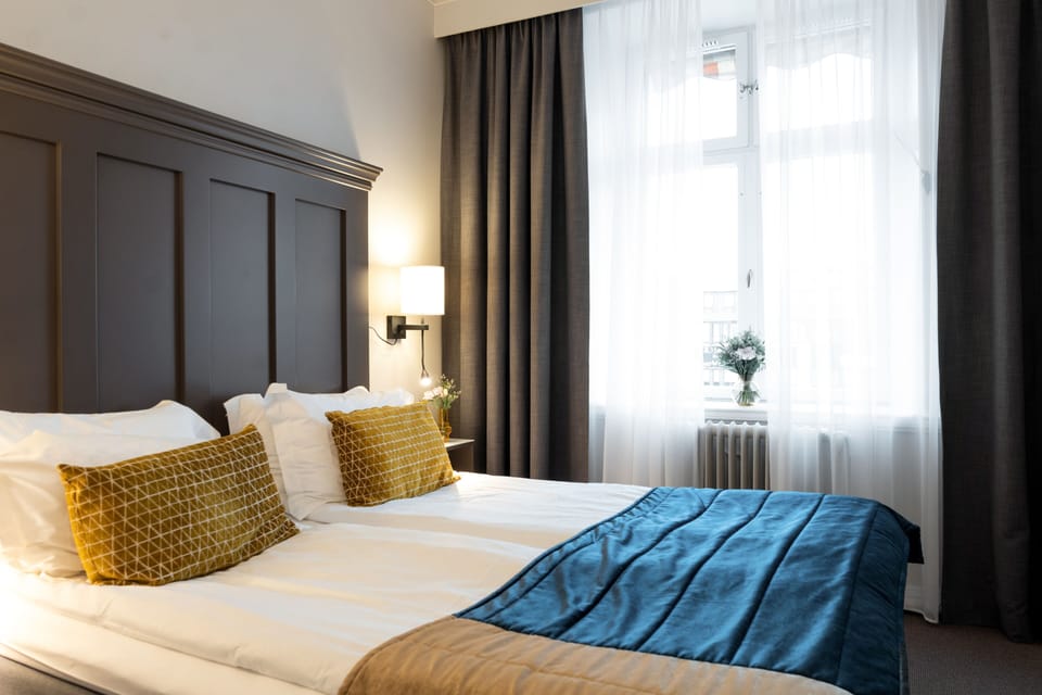 Standard Double Room | Minibar, desk, blackout drapes, iron/ironing board