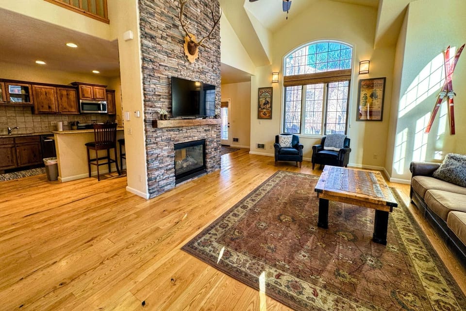 Kick back and relax in the living room, taking advantage of the inviting seating and a large smart TV.