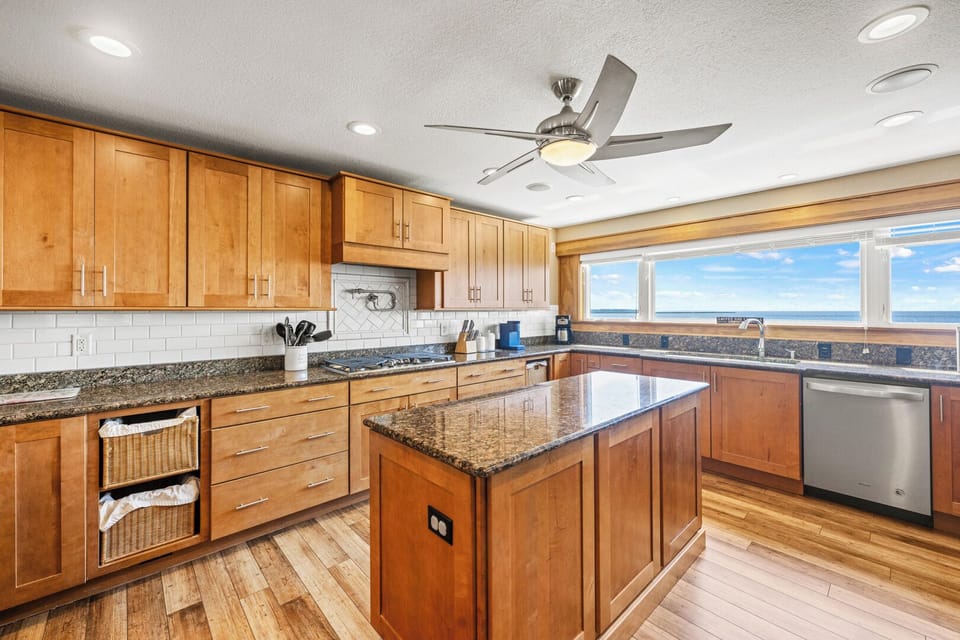 Gourmet Kitchen Area with Bar Seating and Views of the Sound