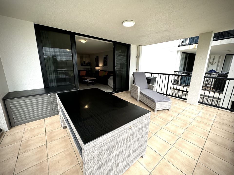 Balcony with Dining table and sunlounge