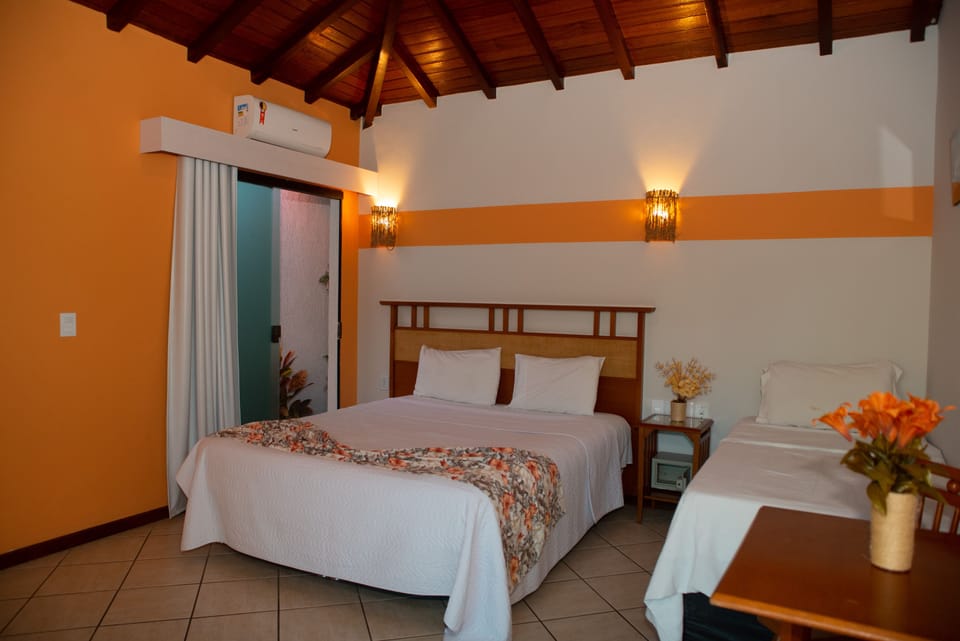 Deluxe Triple Room, Jetted Tub | Minibar, in-room safe, desk, rollaway beds