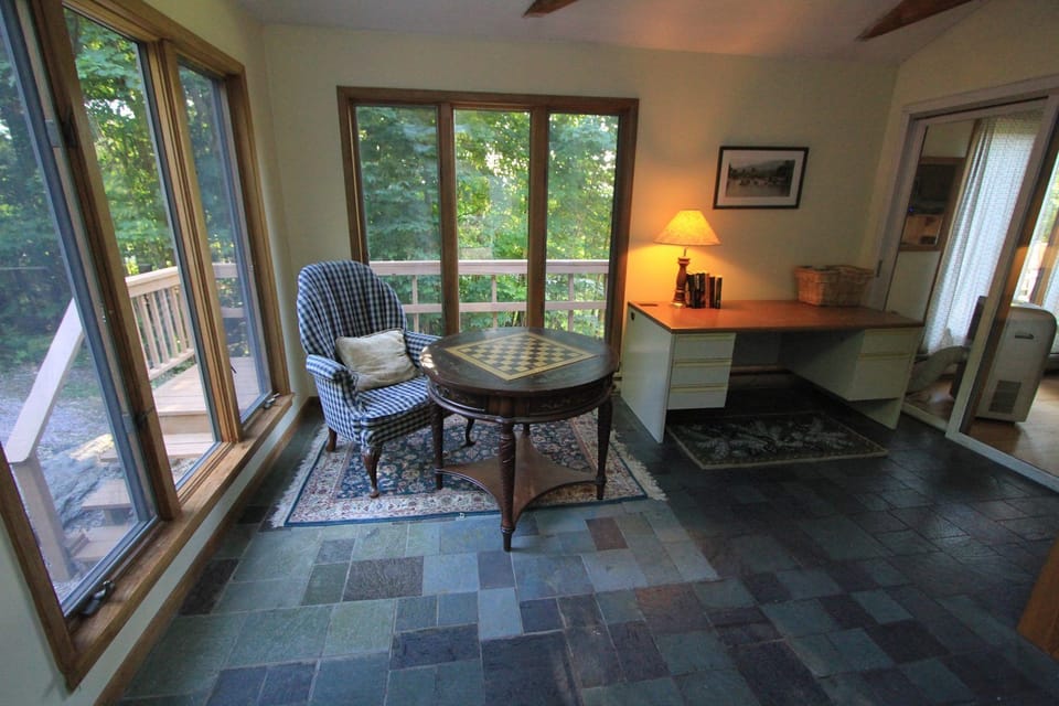 Sunroom / mudroom reading area, games and work desk