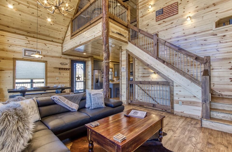 Living room,55 inch tv and wood burning fireplace and dining room