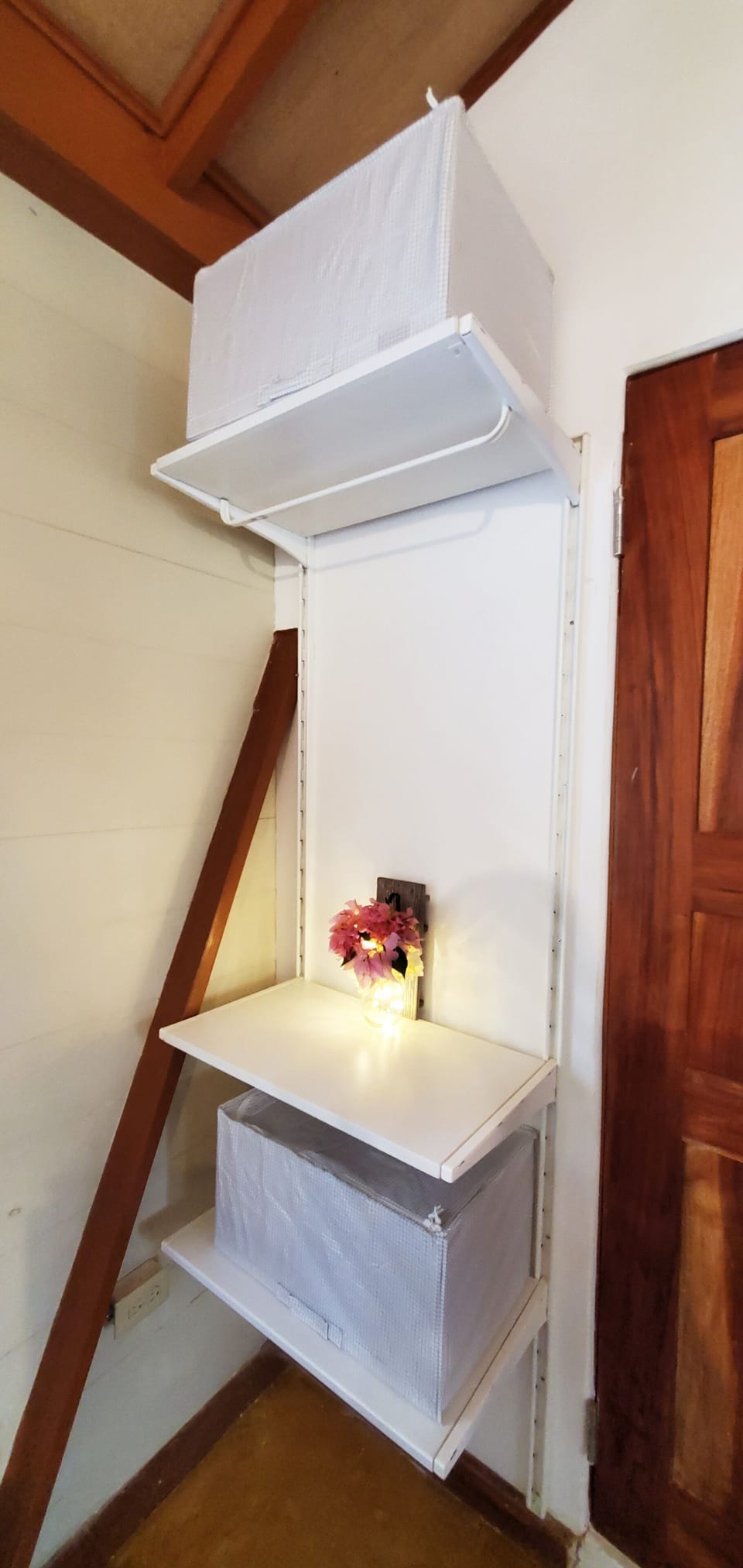 Our closet comes with storage boxes and hangers.