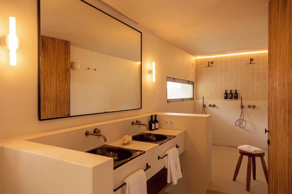 Suite, Sea View | Bathroom | Hair dryer, slippers, towels, soap