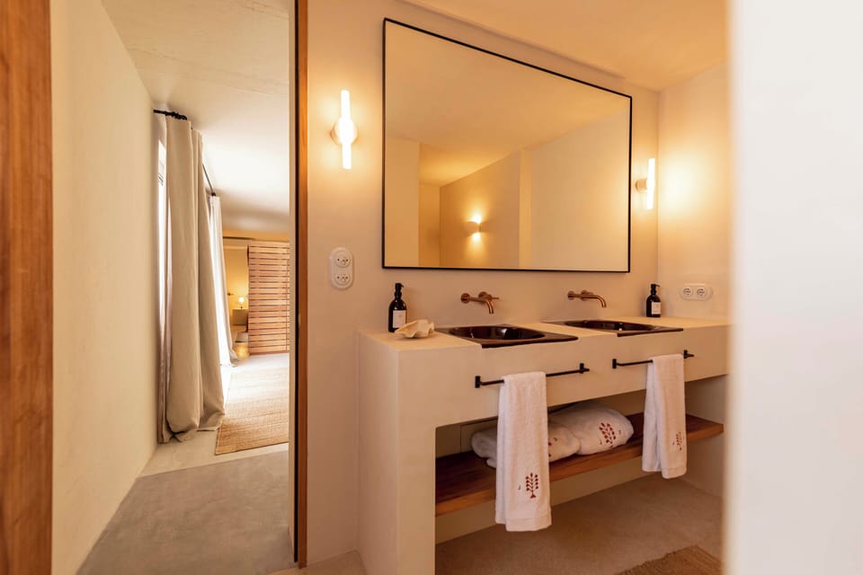 Junior Suite, Pool View | Bathroom | Hair dryer, slippers, towels, soap
