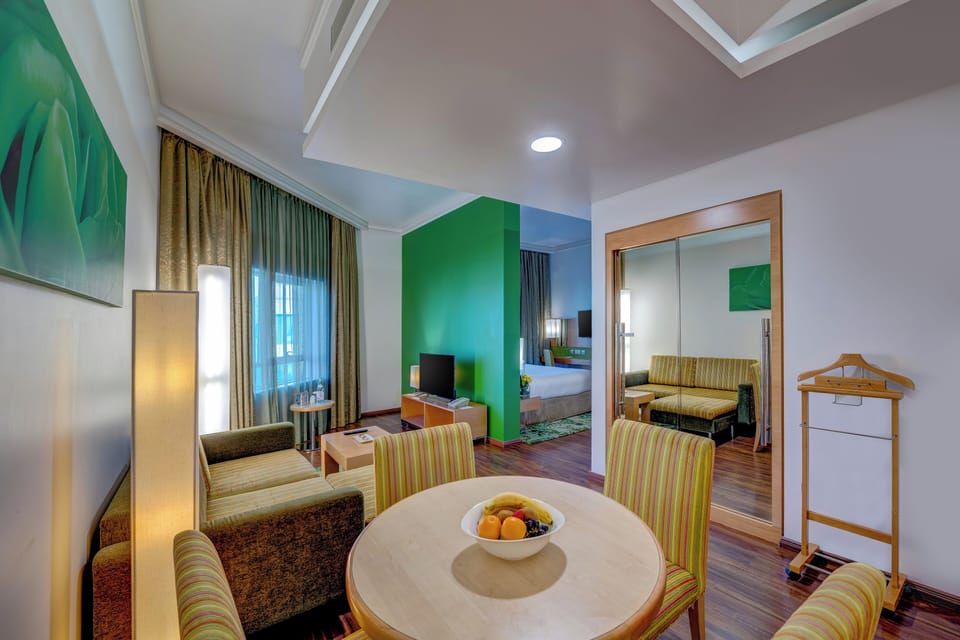 Executive Suite | Living area | 35-inch LCD TV with satellite channels, TV