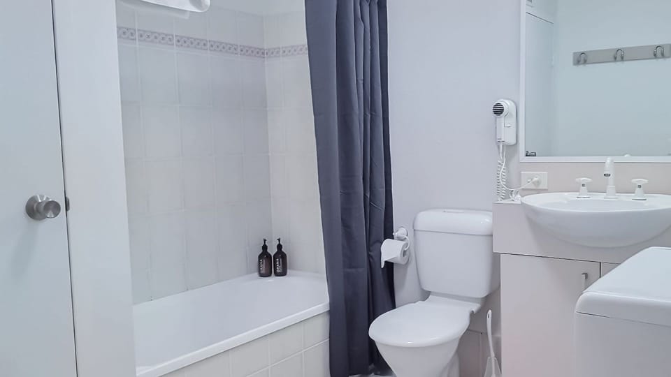 Bathroom shower over bath & Laundry combined with washer/ dryer