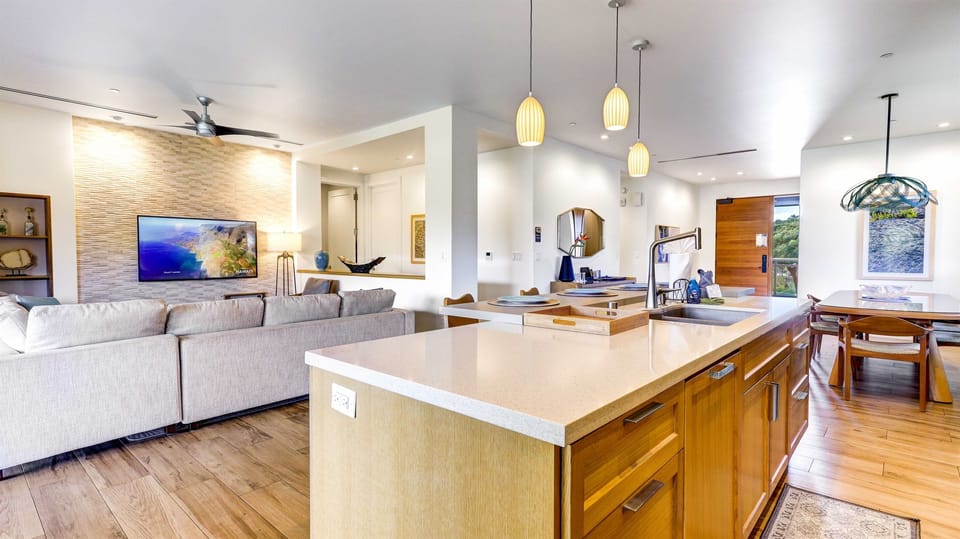 Keep the chef company at the beautiful granite top island with bar seating