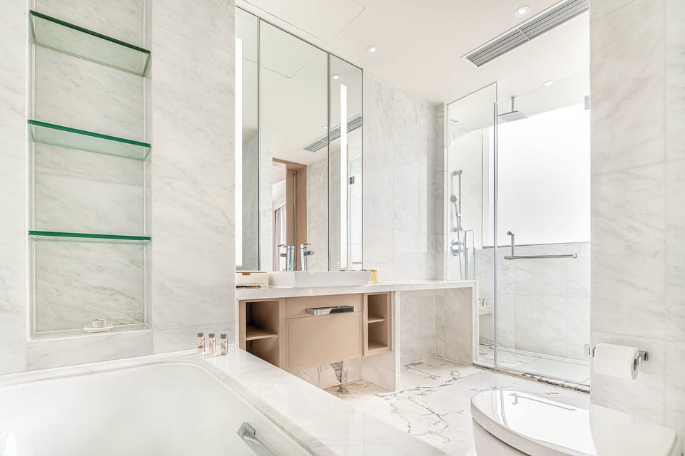 Room, 1 King Bed | Bathroom | Separate tub and shower, deep soaking tub, rainfall showerhead