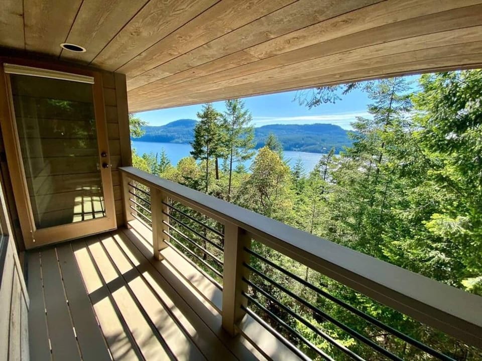 Master Bedroom Balcony view with seating for two.