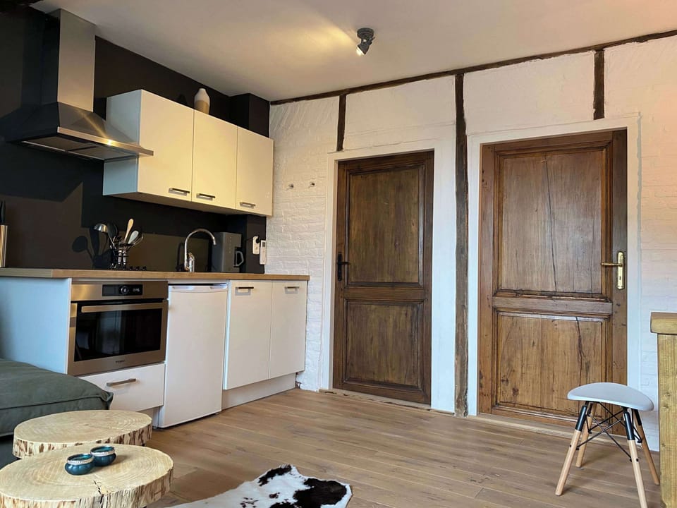 Kitchen and doors to bedroom and bathroom