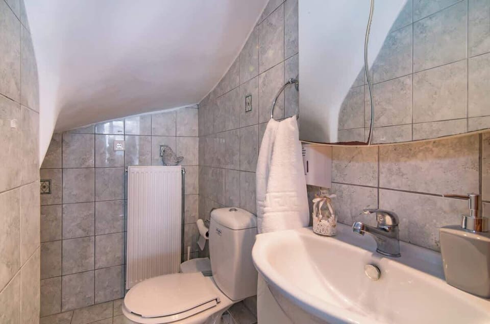 Explore the convenience of Bathroom 2, designed for functionality and comfort during your stay