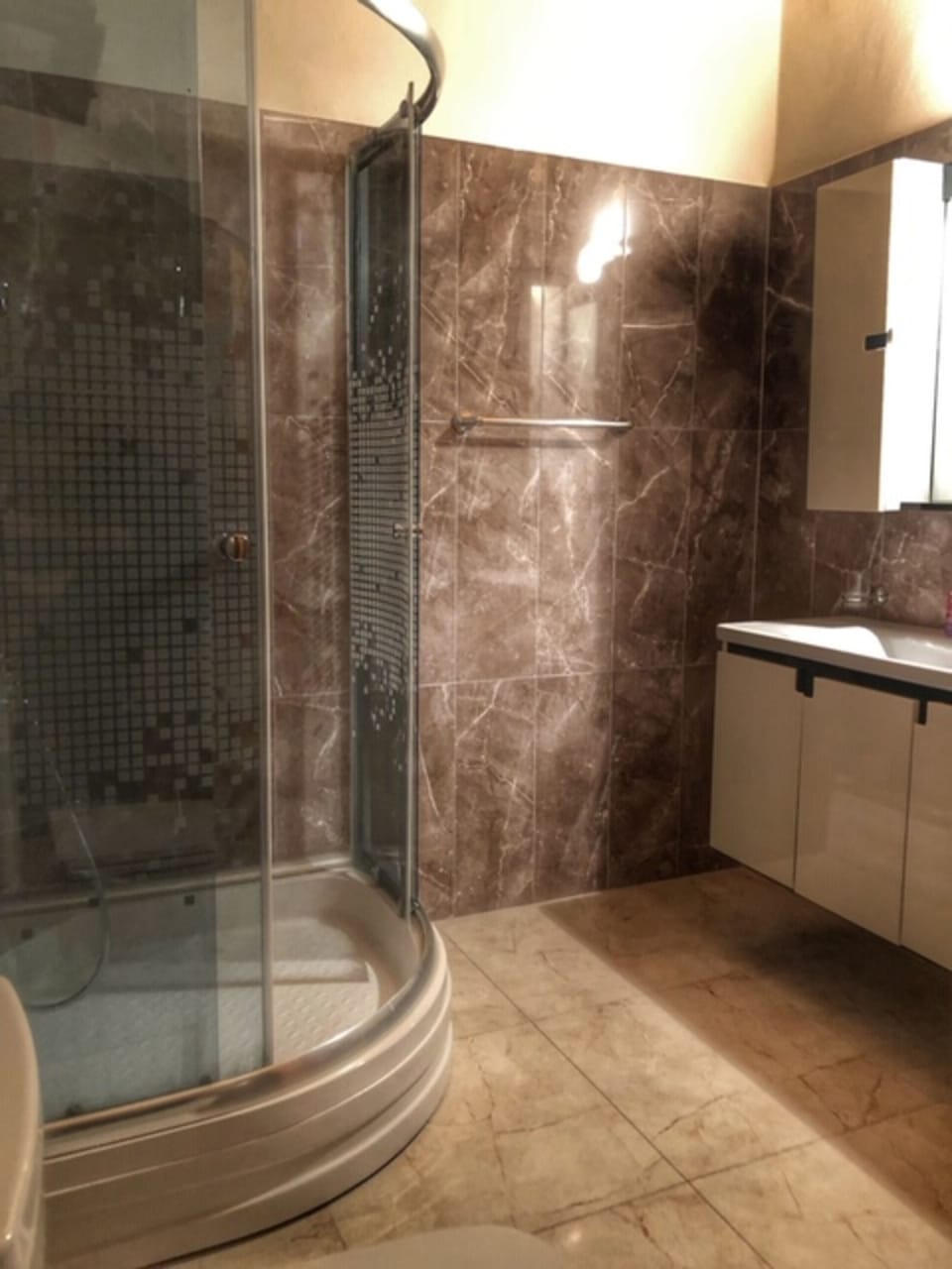 Shower, rainfall showerhead, hair dryer, towels