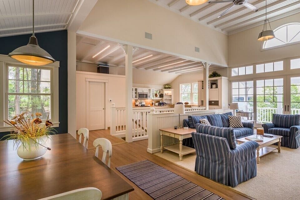 Stairway to enter, open concept of dining, living room, kitchen