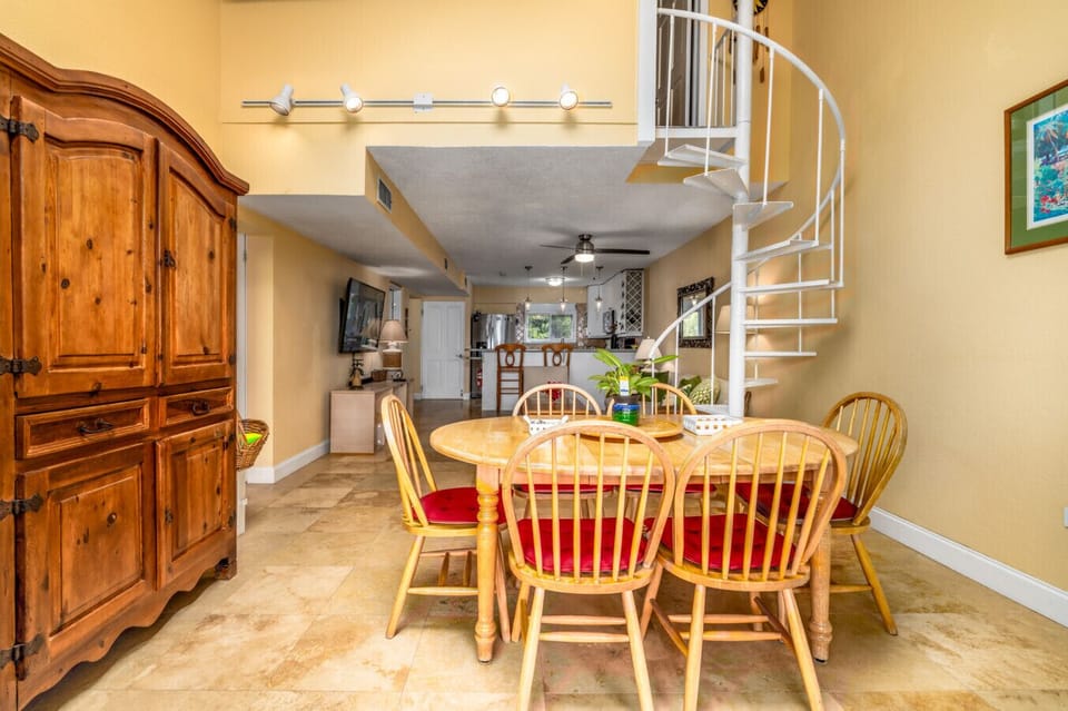 The dining area, with the living room in the background, as seen from the private balcony.