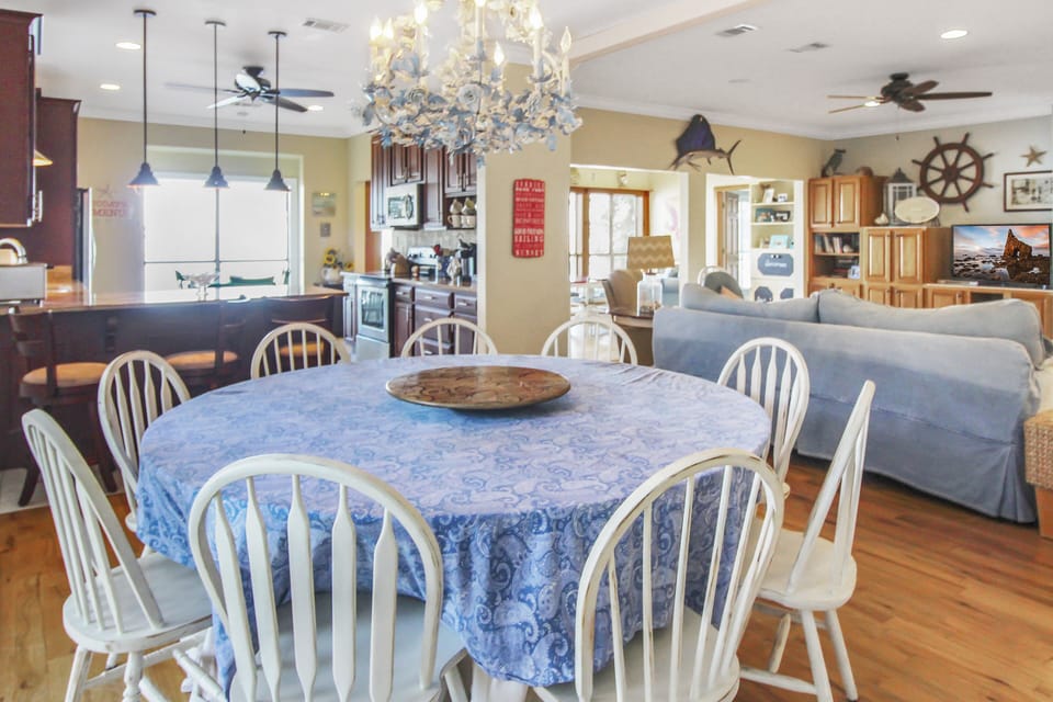 Large dining table can seat 10-12, plus bar with 3 bar stools.