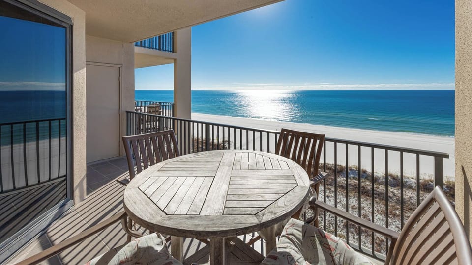 Savor meals at the round table while enjoying breathtaking views of the sparkling waters and shoreline