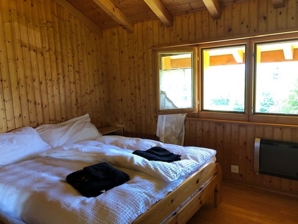 Comfortable room with double bed and window