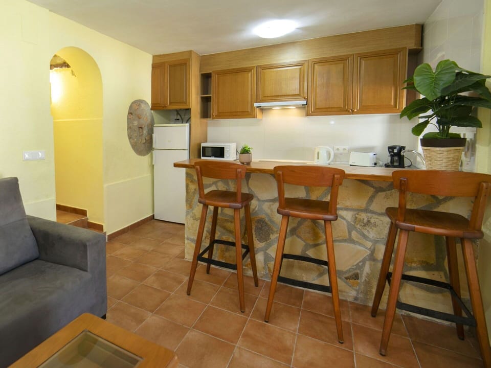 Furniture, Interior Design, Flooring, Wood, Countertop, Floor, Ceiling, Kitchen, Room, Cabinetry