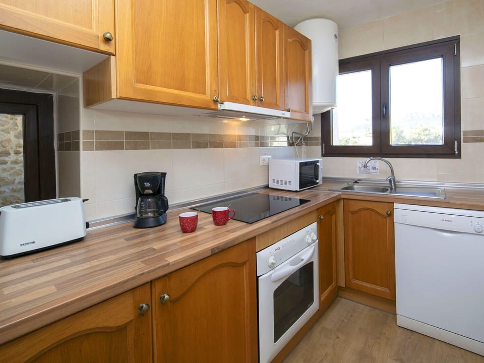 Kitchen Appliance, Kitchen, Countertop, Cabinetry, Major Appliance, Kitchen Sink, Furniture, Interior Design, Kitchen Stove, Stove
