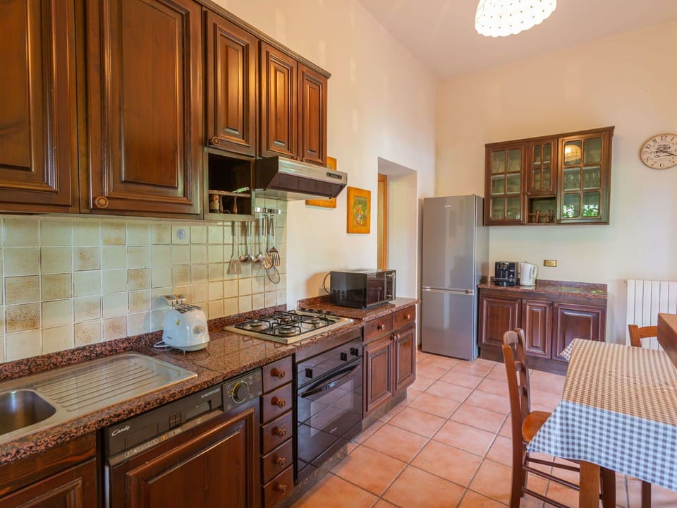 Cabinetry, Countertop, Furniture, Property, Kitchen, Wood, Kitchen Stove, Interior Design, Kitchen Appliance, Lighting