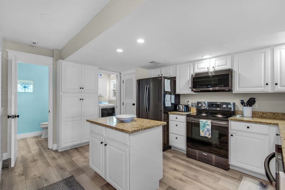 Kitchen Oasis: Labeled cabinets await your culinary adventures!