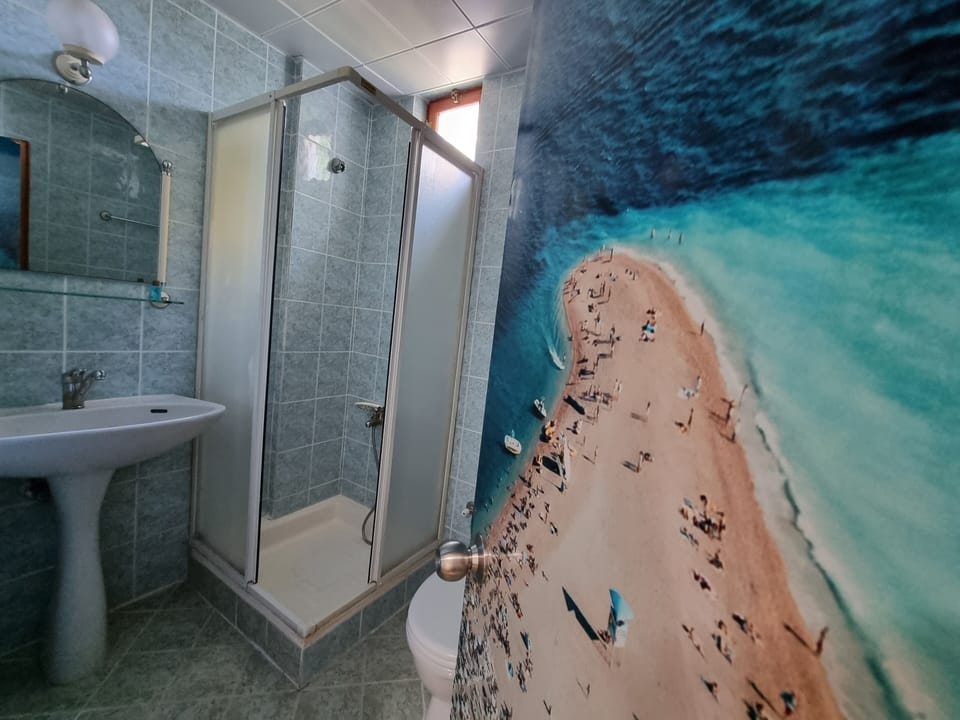 Standard Room, 1 Double Bed | Bathroom | Shower, hair dryer, slippers, towels