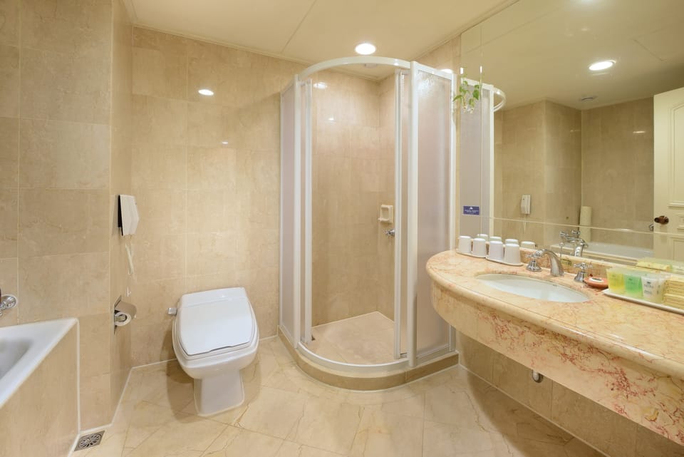 Deep soaking tub, hair dryer, slippers, towels