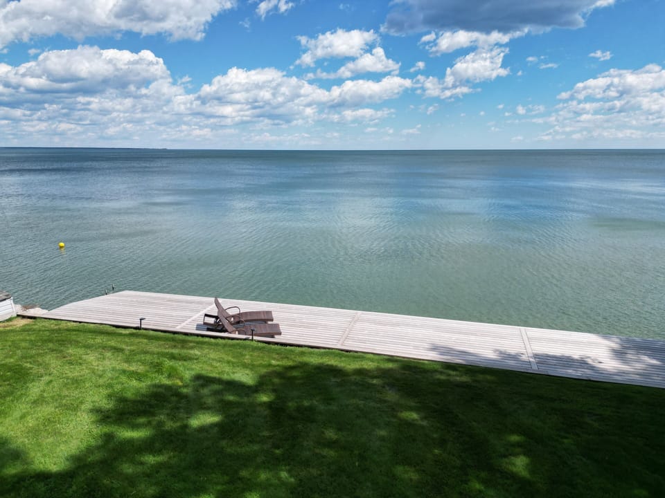 NEW EXPANSIVE LAKE DECK WITH STAIRS TO WATER