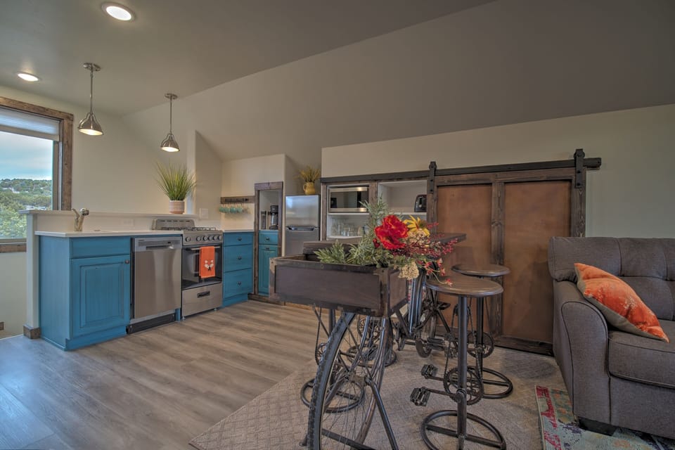 Kitchen showing sliding barn door open to pantry