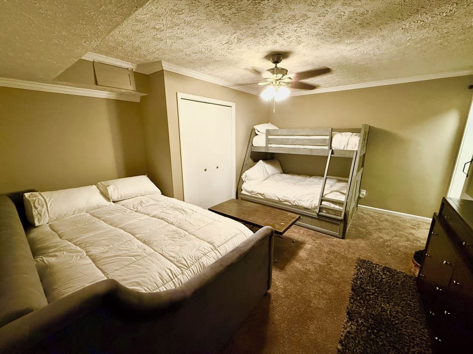 4th Guest bedroom downstairs with Full bed, twin bunks, & 55” LED TV, sleeps 3.