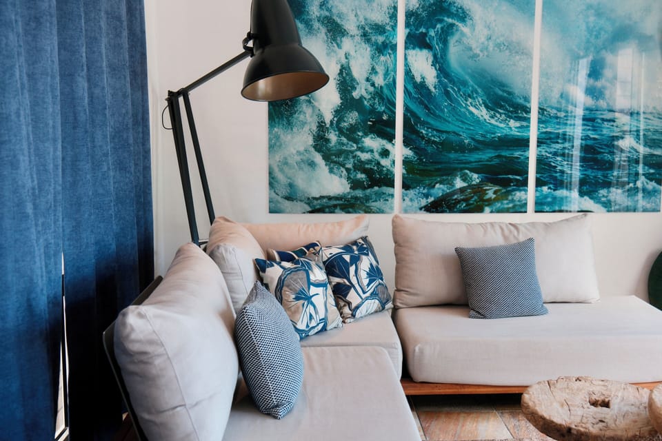 Suite, Beachfront | Living area | Flat-screen TV, iPod dock