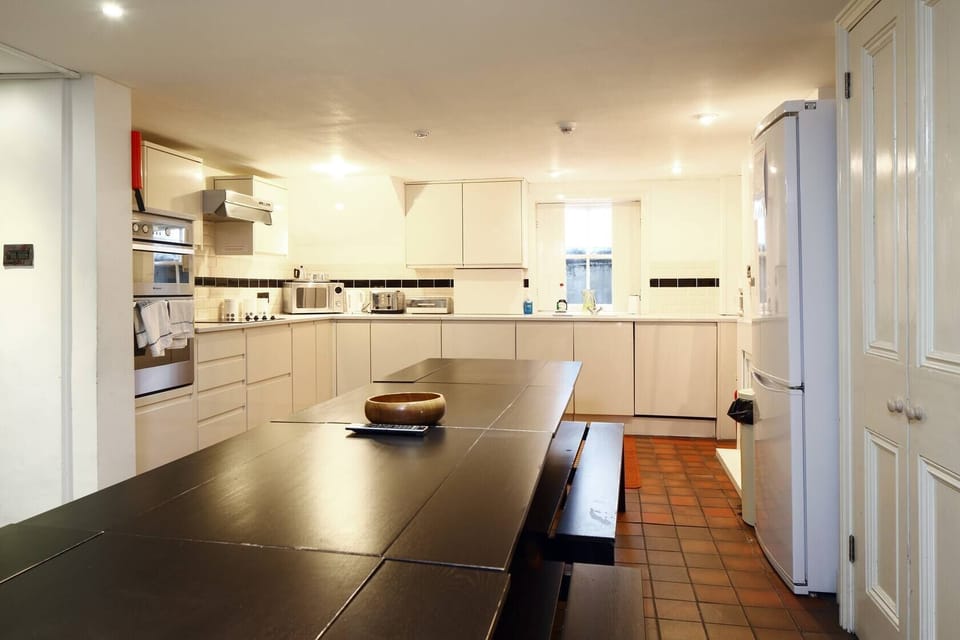 Large Kitchen and dining table which seats 10