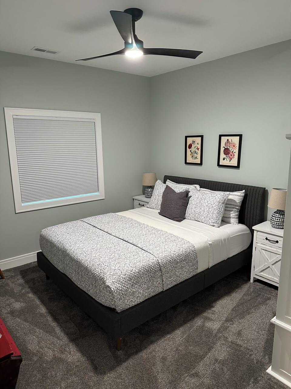 5th bedroom with queen bed and armoire and trunk for your clothing.