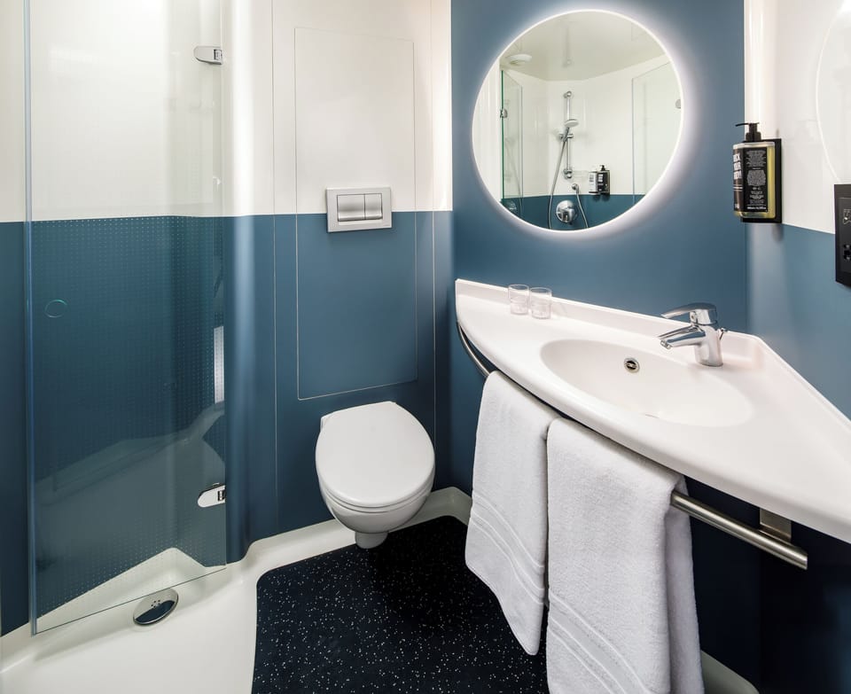 Shower, eco-friendly toiletries, hair dryer, towels