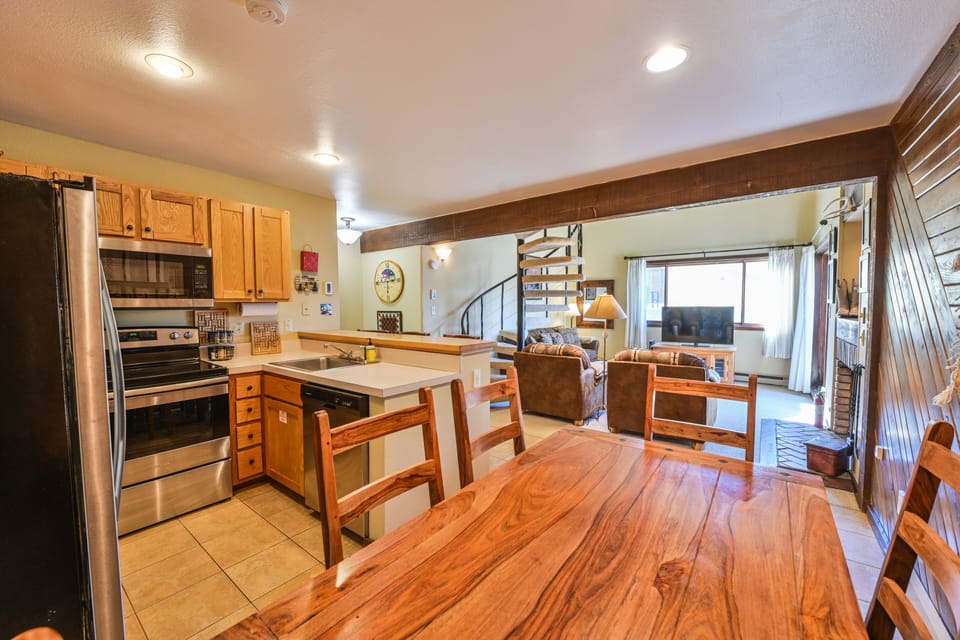 Dining room table that seats 6 + 3 bar stools at the breakfast bar