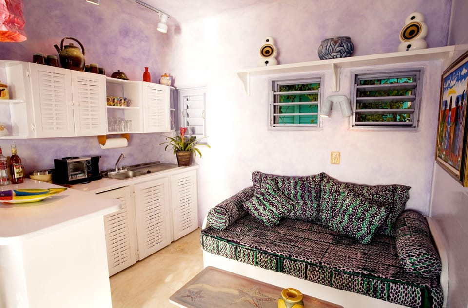 Room, 1 King Bed, Ocean View (One Bedroom Ocean View Cottage) | Minibar (free items), in-room safe, desk, laptop workspace