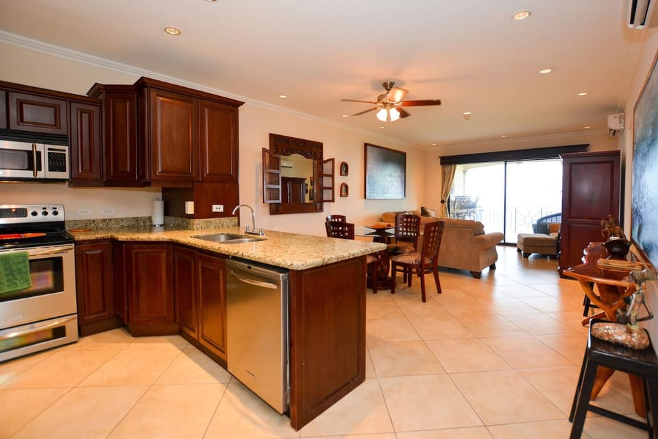Condo, 2 Bedrooms | Private kitchen | Full-size fridge, microwave, stovetop, dishwasher