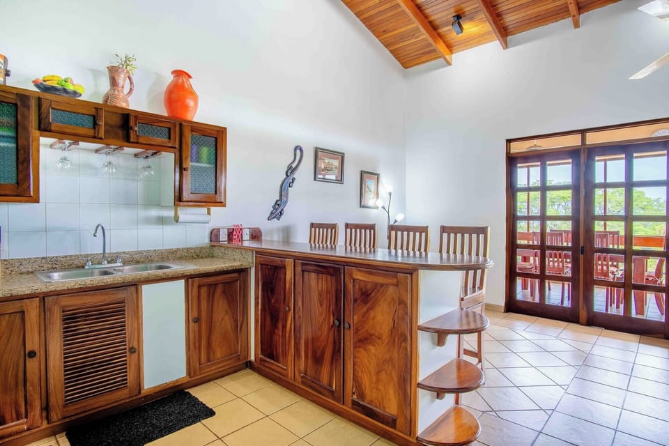 Full-size fridge, stovetop, dishwasher, coffee/tea maker