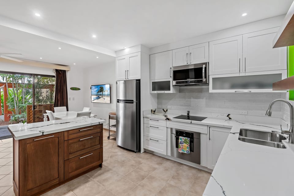 Apartment, 2 Bedrooms | Private kitchen | Full-size fridge, microwave, stovetop, coffee/tea maker