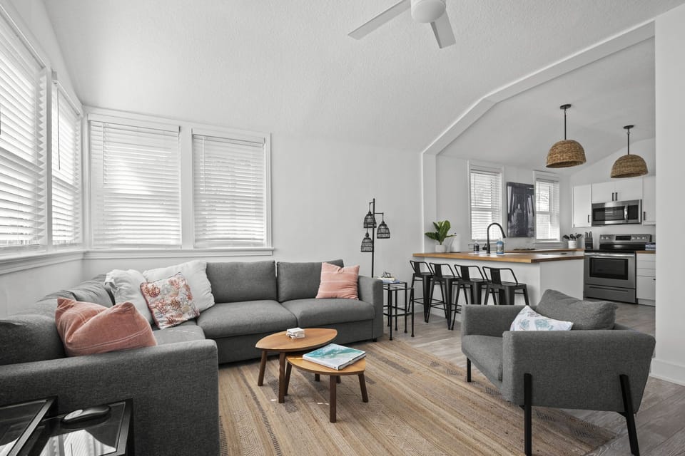 Open Concept Family room and Kitchen. Sectional sofa with Full size bed.