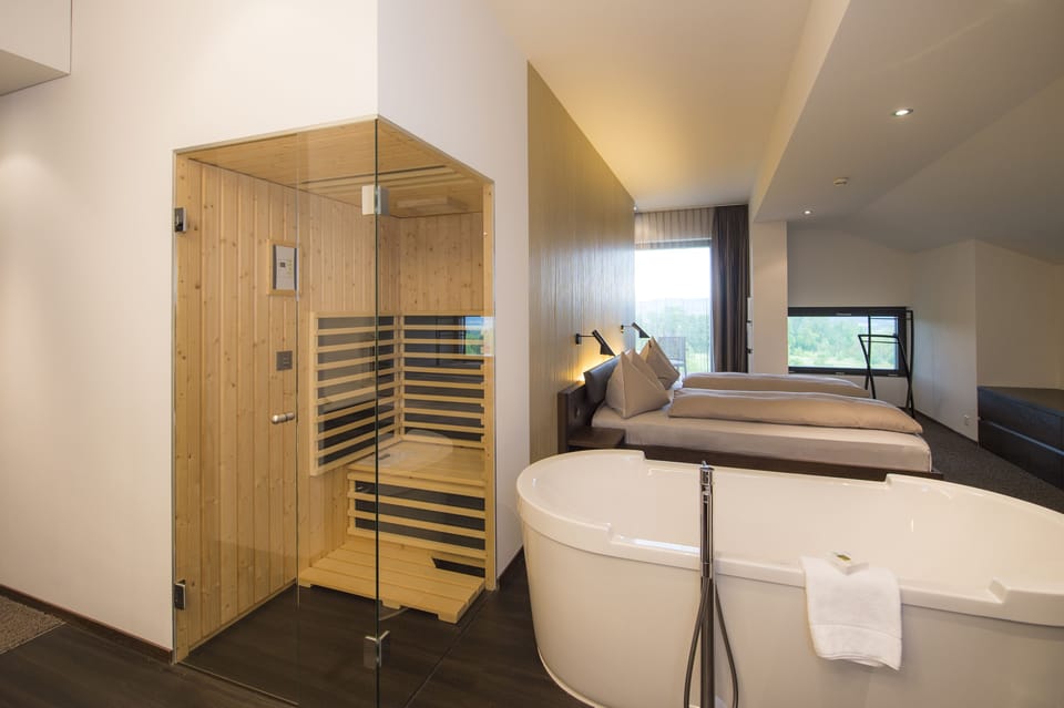 Designer toiletries, hair dryer, bathrobes, slippers