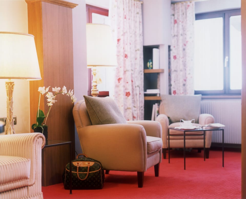 Junior Suite (Private Edition) | Living area | 120-cm flat-screen TV with cable channels, TV, DVD player