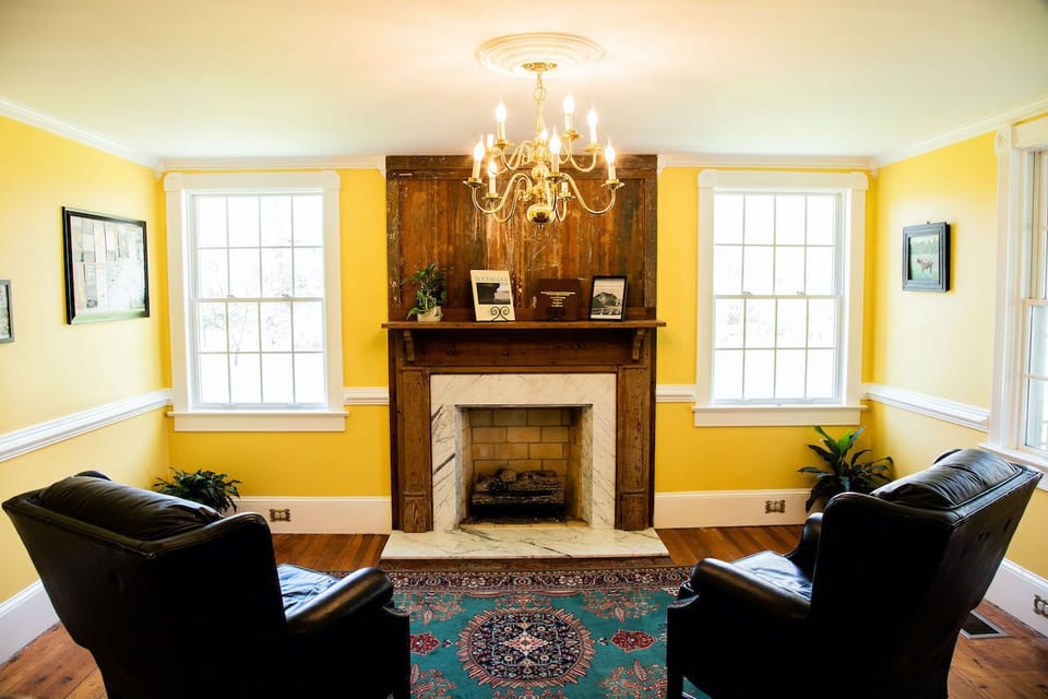 Living room #2 with gas fireplace and river views.