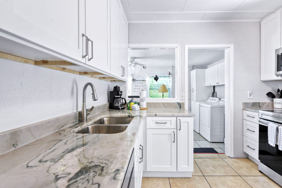 Newly updated kitchen featuring granite counters and new stainless appliances