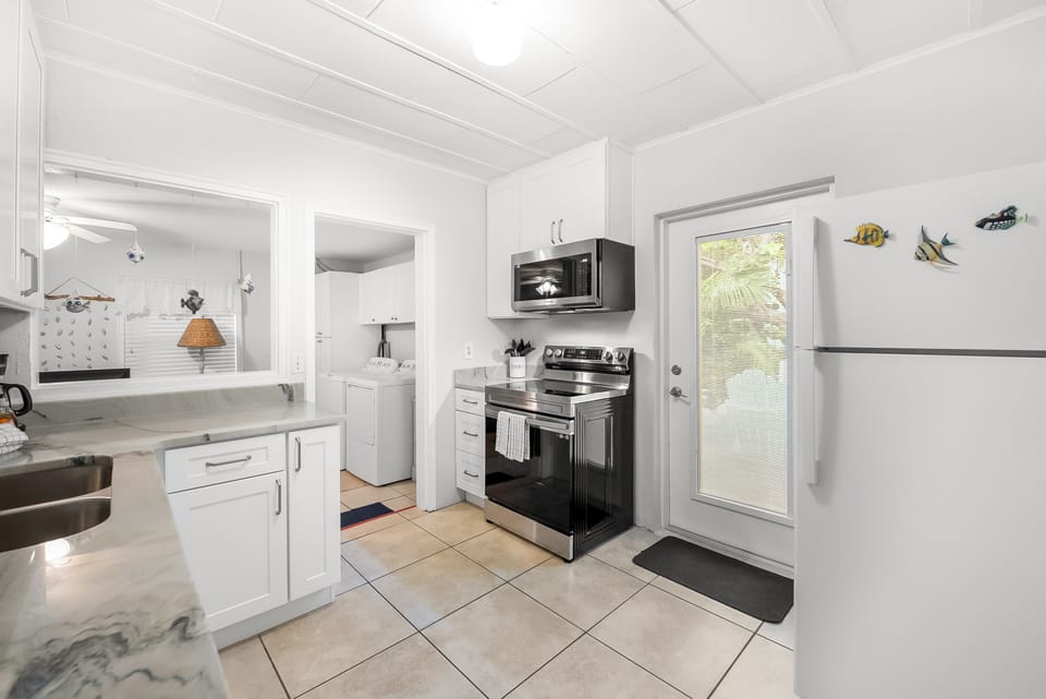 Kitchen showing fridge and range