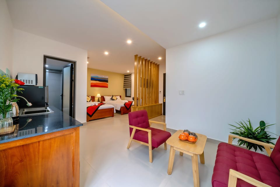 Luxury Triple Room | Private kitchen | Coffee/tea maker, electric kettle, highchair, paper towels