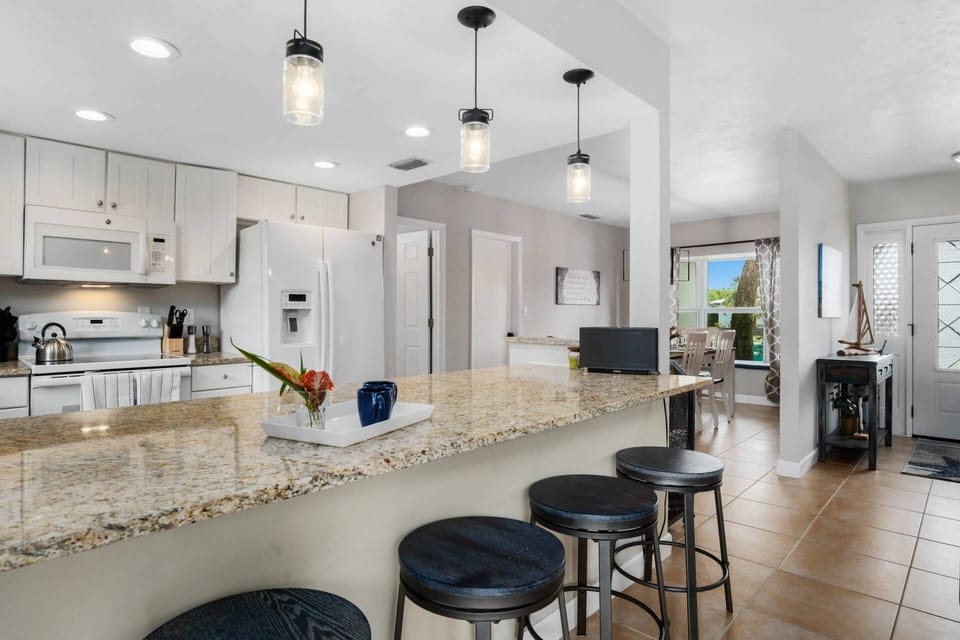Pull up a stool to the breakfast bar for a more casual dining option.